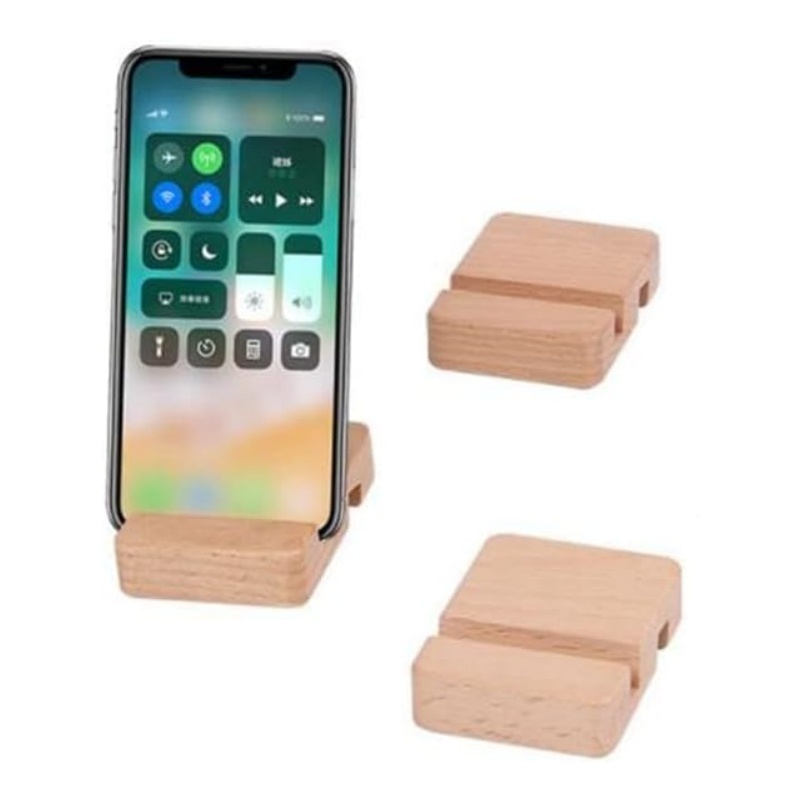 The wooden phone stand placed on the desk looks like a mini work of art