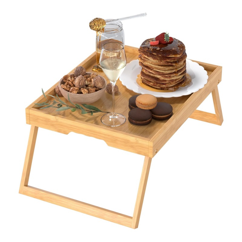 The bamboo bed tray held the coffee and the mobile phone steady.
